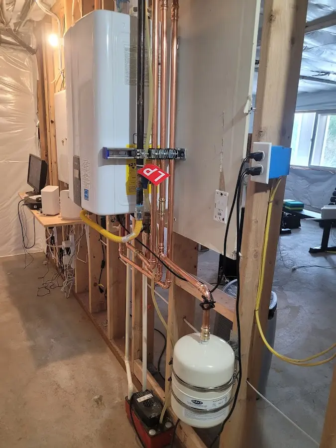 Licensed plumber repairing a kitchen sink in Douglas