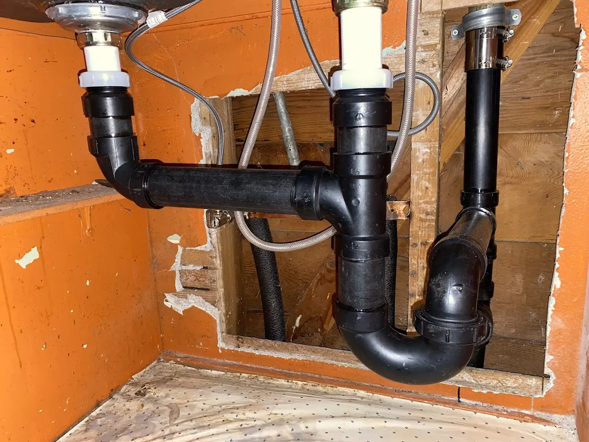 Professional Garbage Disposal Repair equipment and tools on the job in Douglas